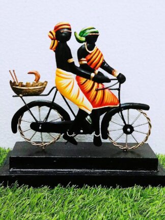 Tribal Couple on Cycle