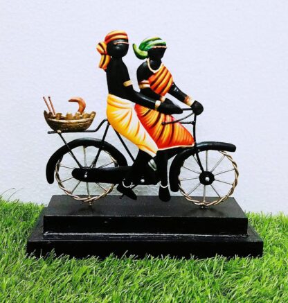 Tribal Couple on Cycle